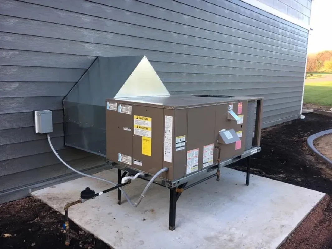 HVAC Glossary: Key Air Conditioning Terms Explained 3 Technician performing HVAC maintenance tasks like filter replacement and duct cleaning